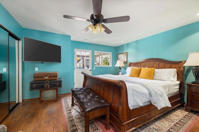 bedroom featuring a closet, hardwood / wood-style flooring, and ceiling fan