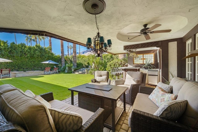 view of patio featuring an outdoor kitchen, ceiling fan, and an outdoor hangout area