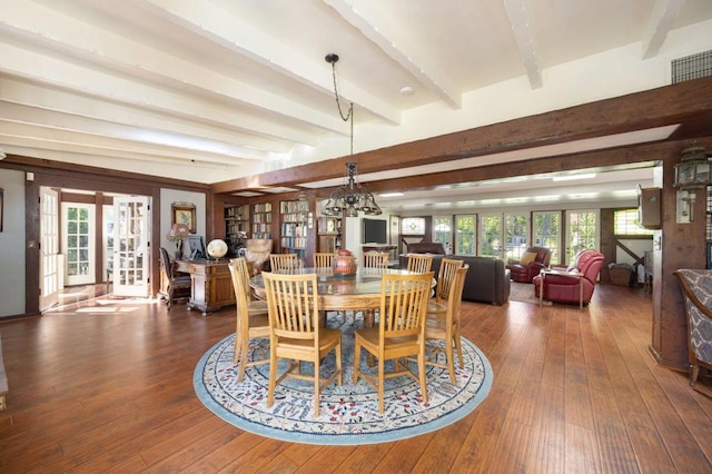 dining room featuring beam ceiling, dark hardwood / wood-style floors, and french doors