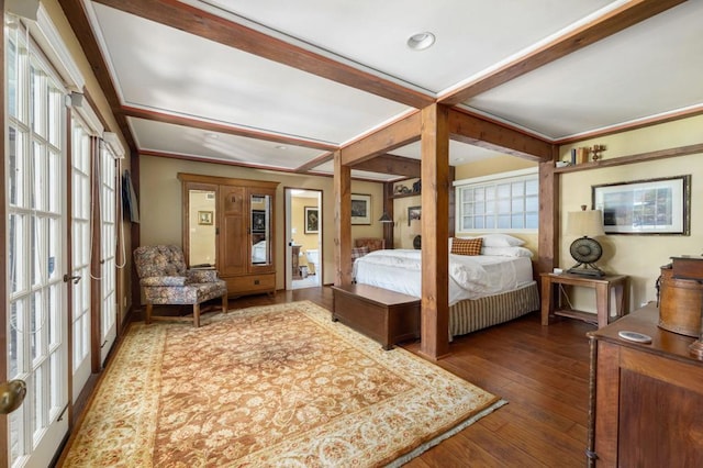 bedroom with french doors and dark hardwood / wood-style flooring