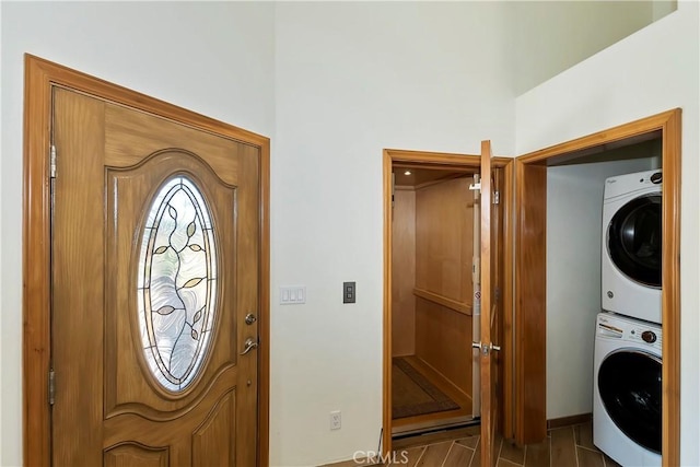 interior space with stacked washer and clothes dryer