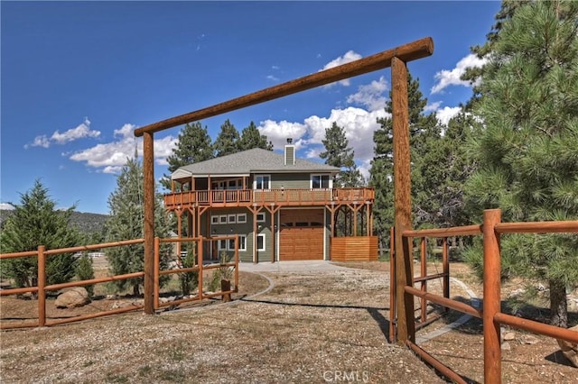 exterior space with a garage and a deck