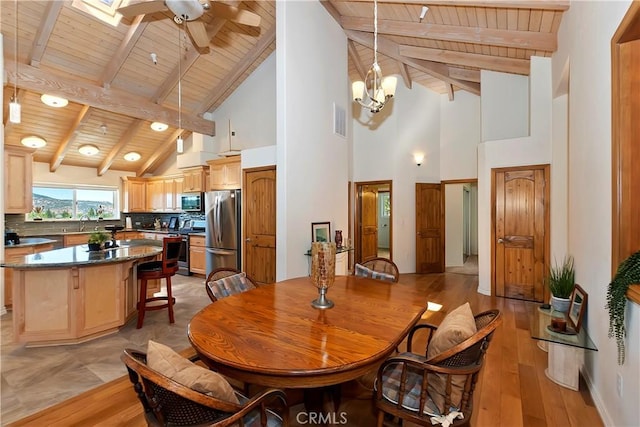 dining room featuring beamed ceiling, high vaulted ceiling, wood ceiling, and light wood-type flooring