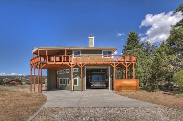 view of front facade featuring a carport and a deck