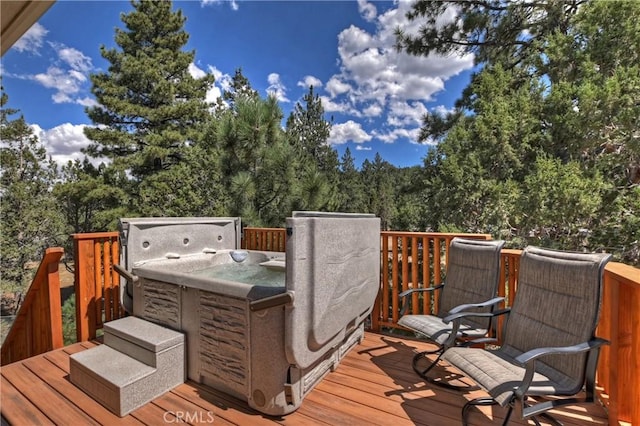 deck featuring a hot tub