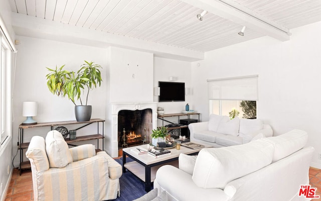 living room with wood ceiling and beam ceiling