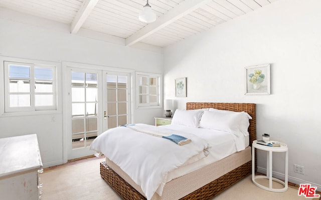 bedroom with wood ceiling, beam ceiling, and french doors