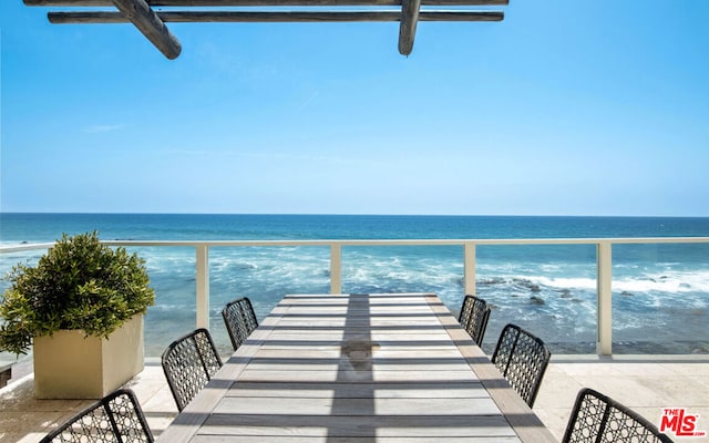 balcony featuring a boat dock and a water view