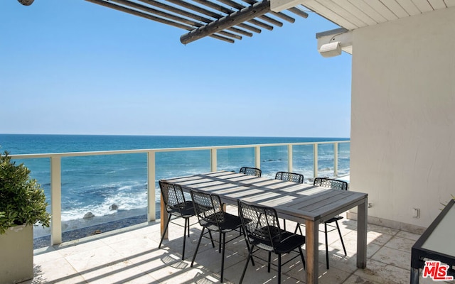 balcony featuring a water view and a pergola