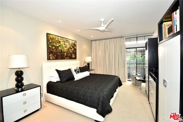 carpeted bedroom with ceiling fan