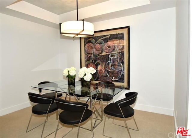 dining space with light carpet