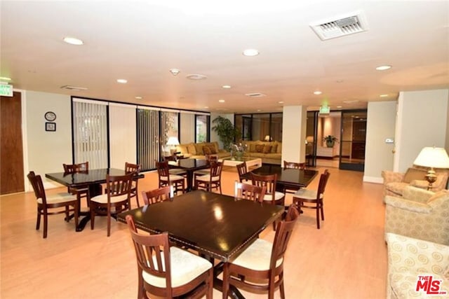 dining room featuring light hardwood / wood-style flooring