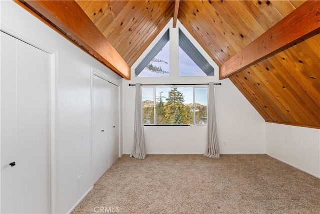 additional living space with vaulted ceiling with beams, light colored carpet, and wooden ceiling