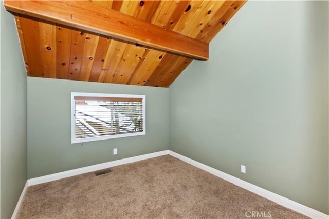 bonus room with lofted ceiling with beams, carpet floors, and wooden ceiling