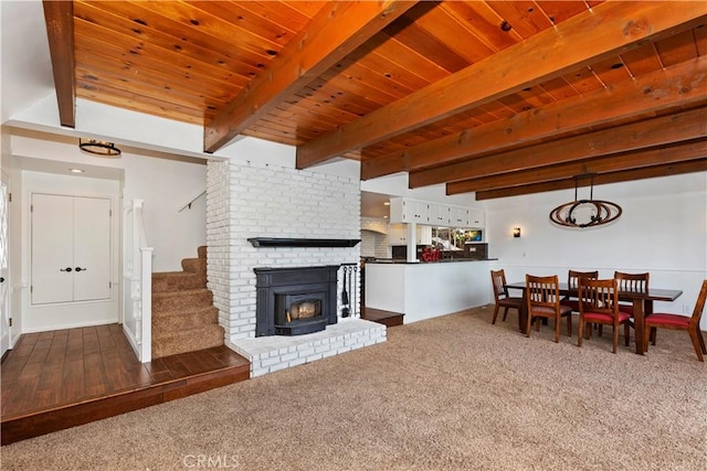 living room with beamed ceiling and wooden ceiling