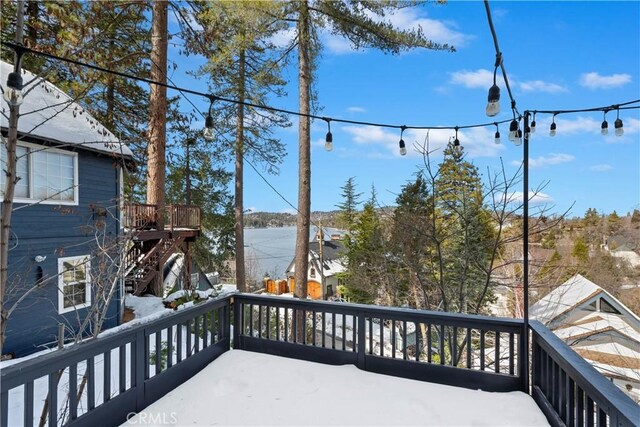 wooden deck with a water view