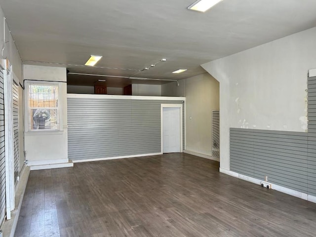 spare room featuring dark hardwood / wood-style floors