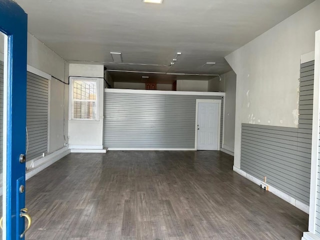 spare room with dark hardwood / wood-style flooring