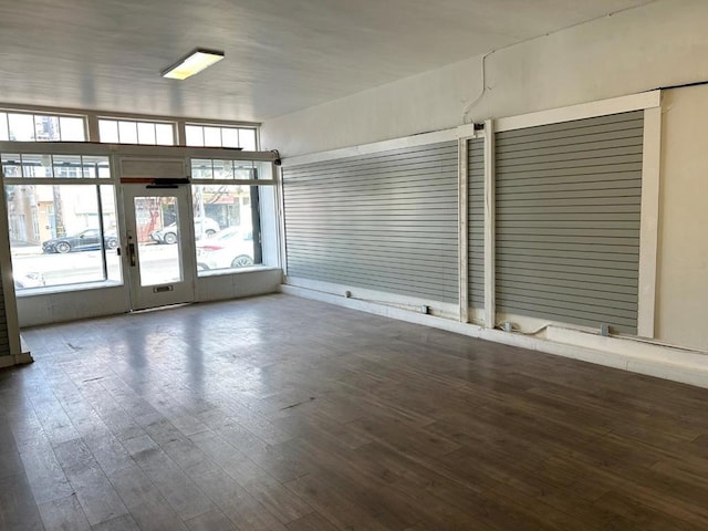 unfurnished room featuring dark hardwood / wood-style flooring