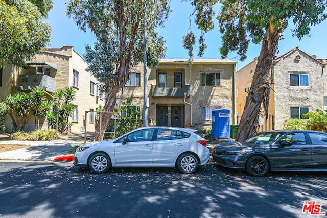 view of front of property with a balcony