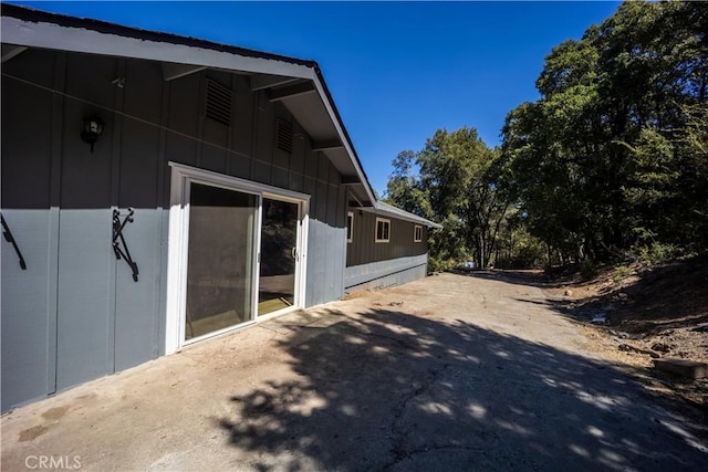 view of property exterior featuring a patio area