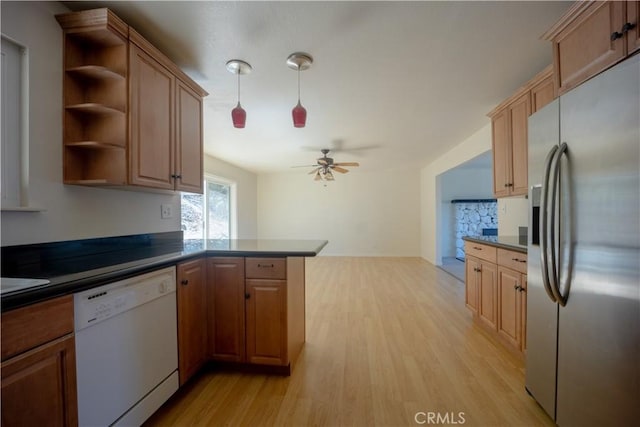 kitchen with dishwasher, stainless steel refrigerator with ice dispenser, ceiling fan, light hardwood / wood-style floors, and kitchen peninsula