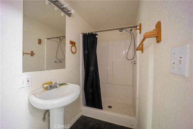 bathroom featuring tile patterned flooring and a shower with curtain