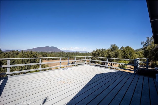 wooden deck with a mountain view