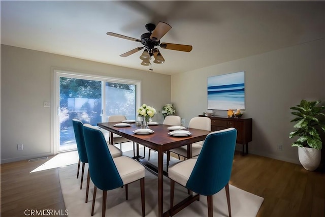 dining area featuring ceiling fan and hardwood / wood-style flooring