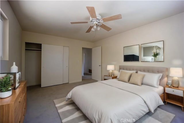 carpeted bedroom featuring ceiling fan and a closet