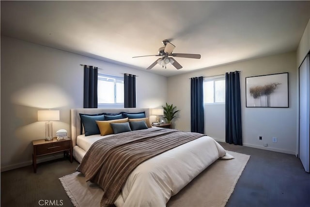 bedroom with multiple windows and ceiling fan