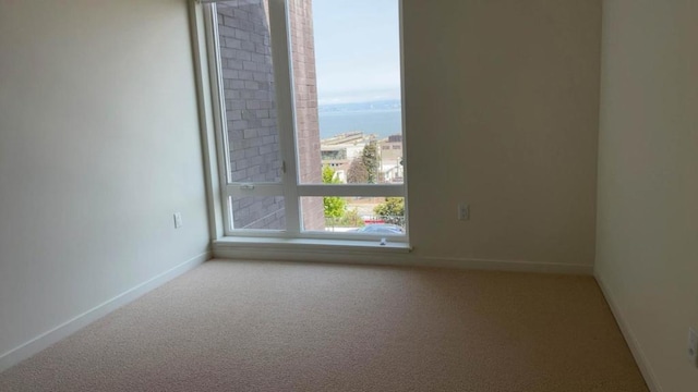 empty room featuring carpet flooring