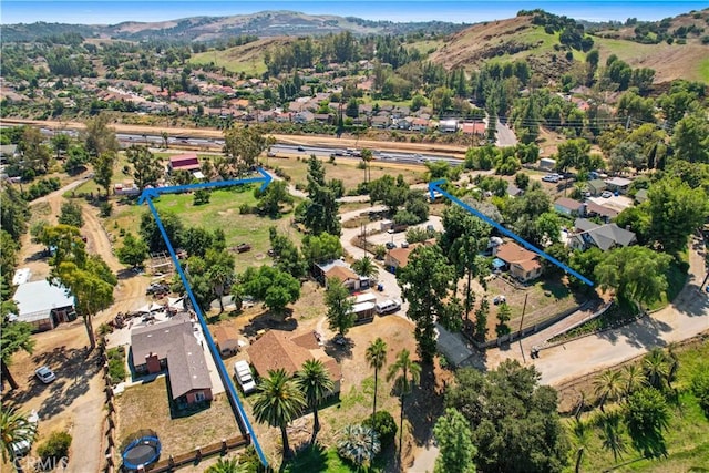 drone / aerial view featuring a mountain view