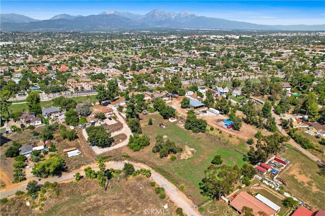 birds eye view of property featuring a mountain view