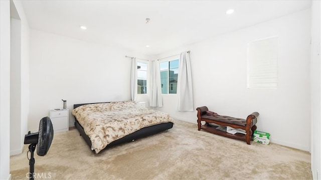 bedroom with light colored carpet