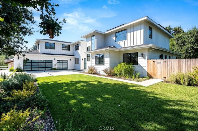 view of front of property with a garage and a front yard