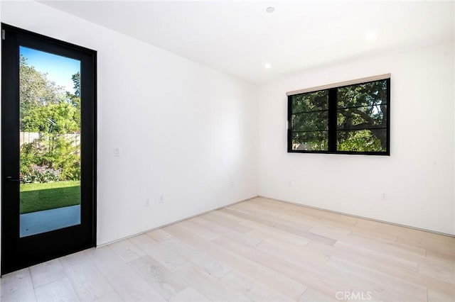 empty room with light hardwood / wood-style floors