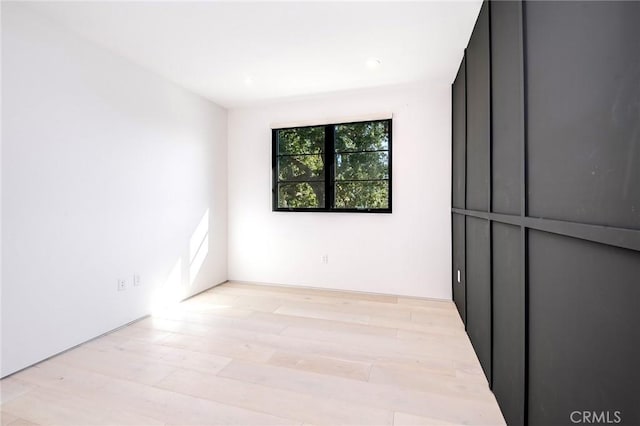 unfurnished room with light hardwood / wood-style floors