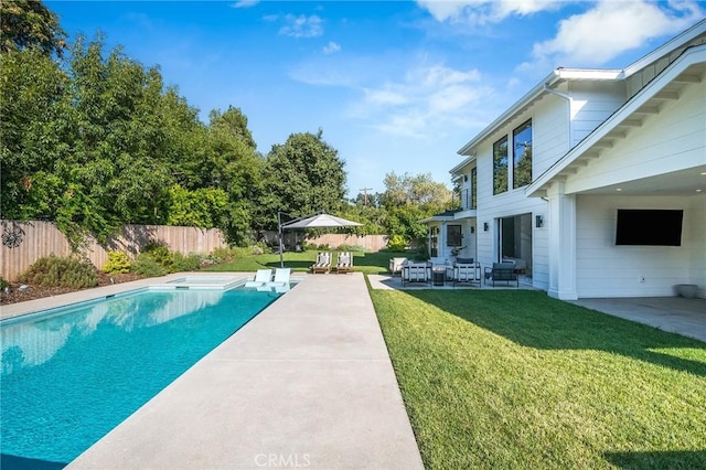 view of pool featuring a patio area and a yard