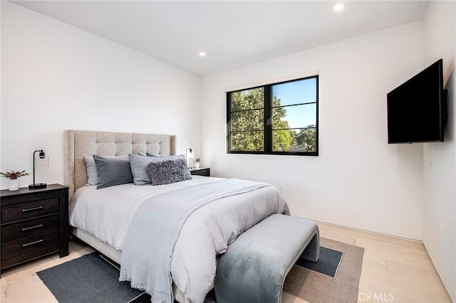 bedroom with light hardwood / wood-style flooring