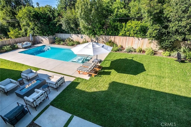 view of pool with a lawn, outdoor lounge area, and a patio