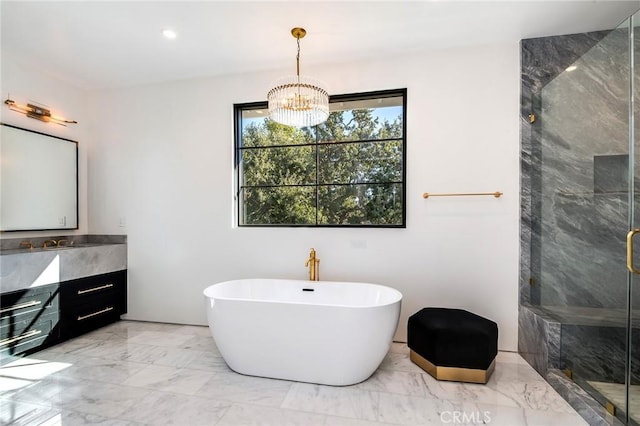 bathroom with vanity, plus walk in shower, and a chandelier