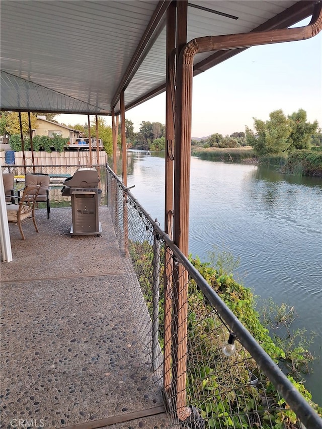 dock area with a water view