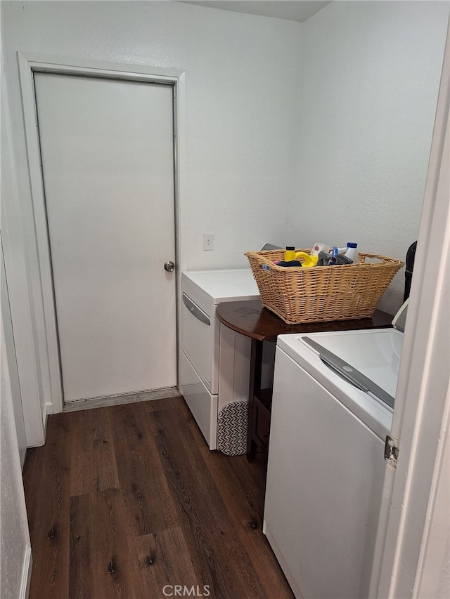 laundry room featuring independent washer and dryer and dark hardwood / wood-style floors