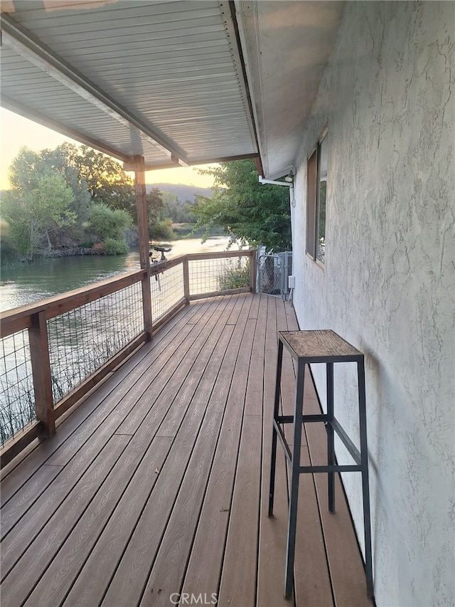 deck at dusk with a water view