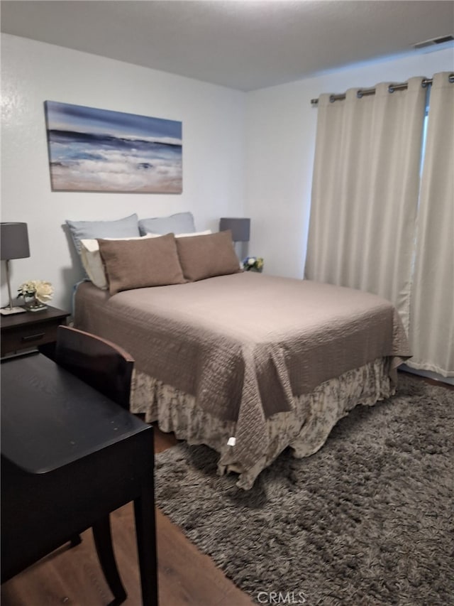 bedroom featuring hardwood / wood-style floors