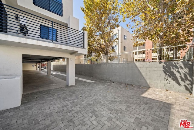 view of patio featuring a carport