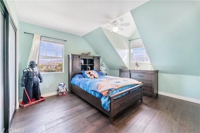 bedroom with multiple windows, ceiling fan, dark hardwood / wood-style floors, and lofted ceiling