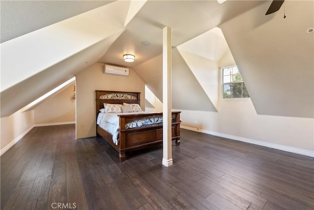 bedroom with a wall unit AC, ceiling fan, dark wood-type flooring, and lofted ceiling