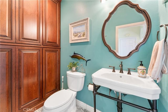 bathroom featuring sink and toilet